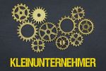 Foto: Zahnräder und Schriftzug Kleinunternehmer